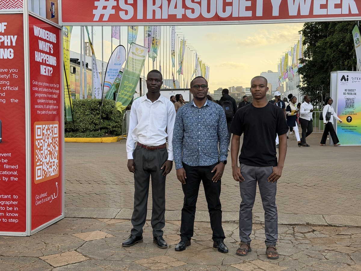 The team outside the KICC venue under #STRI4SOCIETYWEEK banners
